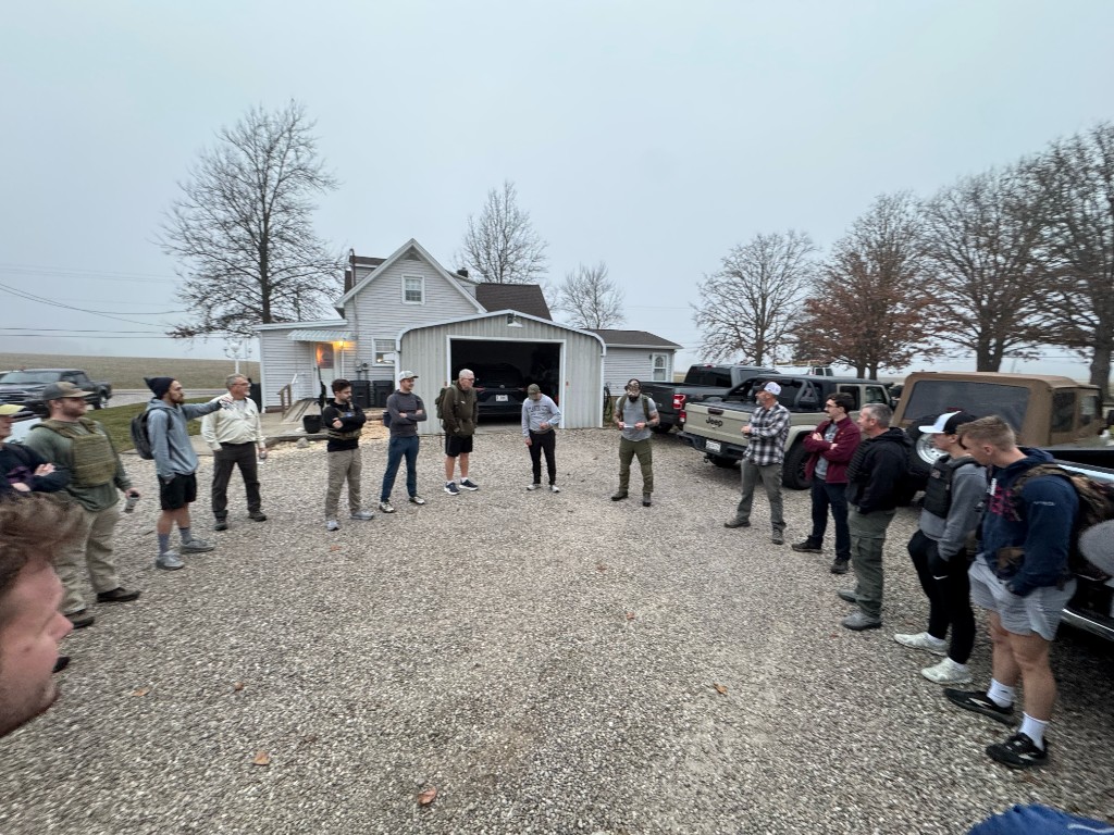 Men gathered in a circle — we start and finish together